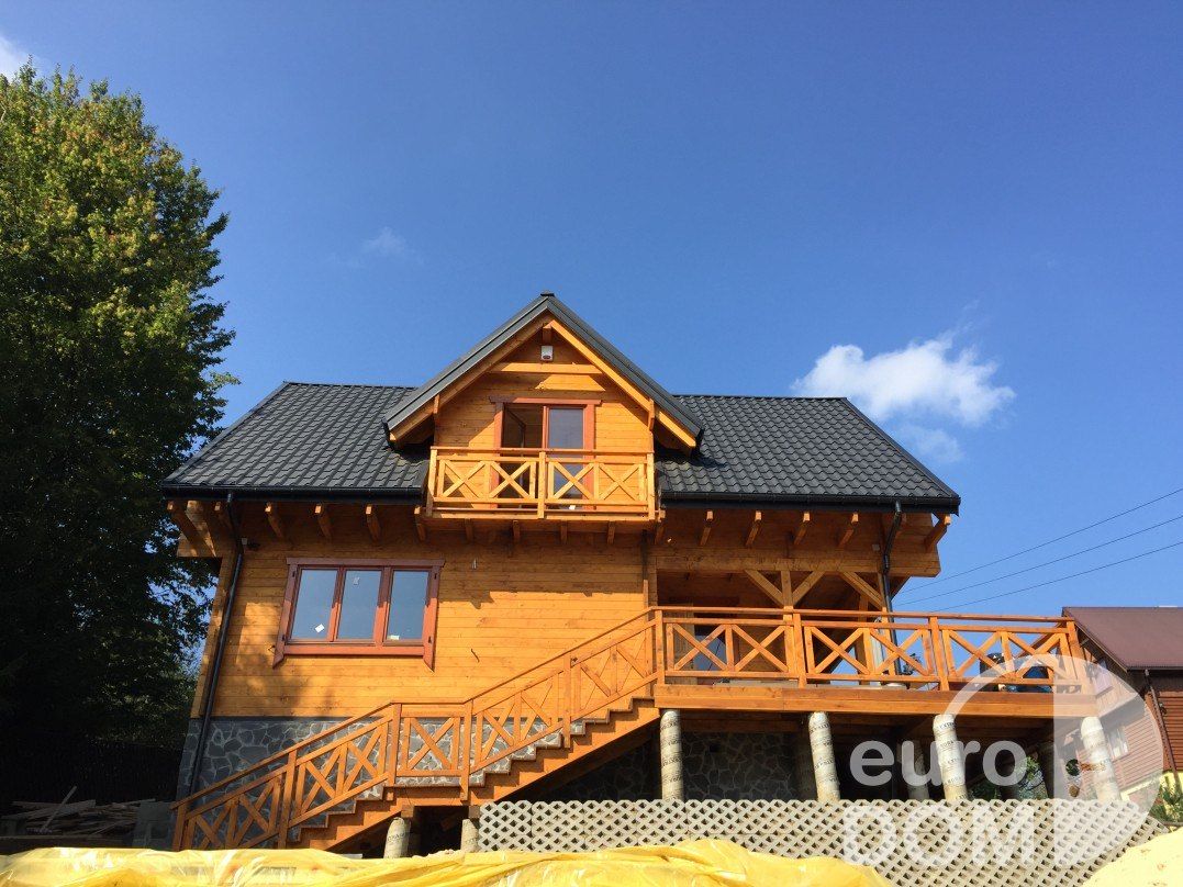 Dom z bali drewnianych z zewnątrz - realizacja Olchowiec